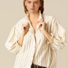 camisa_cruda_raya_marrn_l_0.webp NÍCOLI CAMISA CRUDA RAYA MARRÓN LUREX< Camisas