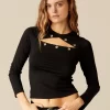 camiseta_tachas_negra_0.webp NÍCOLI CAMISETA TACHAS NEGRA< Camisetas | Tops