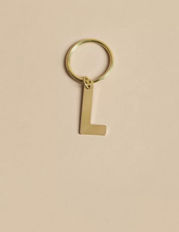 NÍCOLI LLAVERO 'L' DORADO< Llaveros | Llaveros
