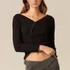 top_cruce_botones_negro_2.webp NÍCOLI TOP CRUCE BOTONES NEGRO< Tops